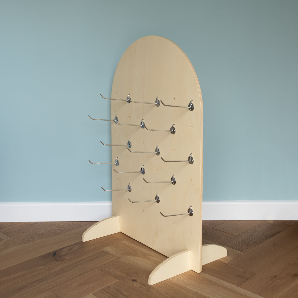 Curved Table Top Pegboard with Retail Hooks