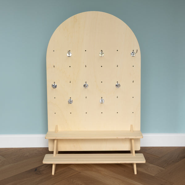 Curved Table Top Pegboard with Tiered Shelving and Retail Hooks